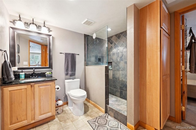 266 Lodgepole Dr, Evergreen, CO 80439 - full bathroom featuring a walk in shower, toilet, vanity, visible vents, and baseboards