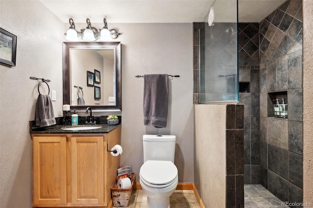 266 Lodgepole Dr, Evergreen, CO 80439 - bathroom with toilet, baseboards, walk in shower, and vanity