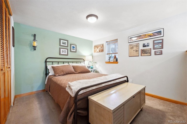 266 Lodgepole Dr, Evergreen, CO 80439 - bedroom with a closet, baseboards, and carpet flooring