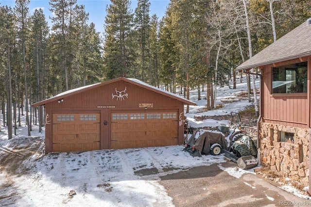 266 Lodgepole Dr, Evergreen, CO 80439 - snow covered garage with a garage