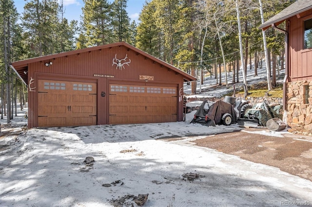 266 Lodgepole Dr, Evergreen, CO 80439 - snow covered garage featuring a garage