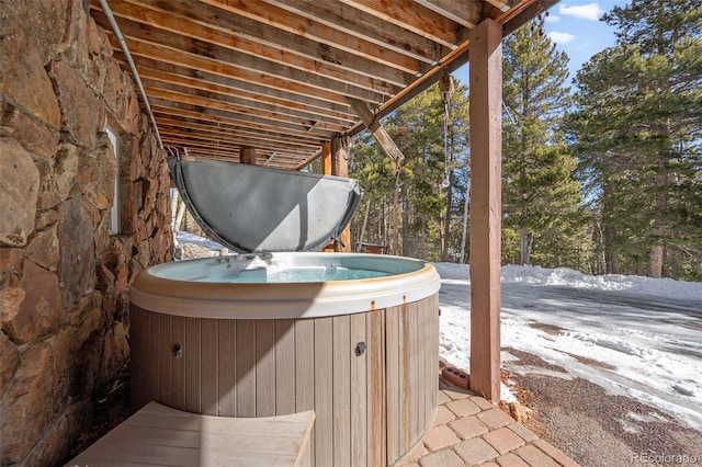 266 Lodgepole Dr, Evergreen, CO 80439 - snow covered patio with a hot tub