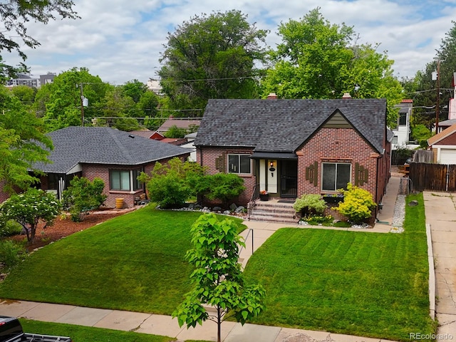 1247 Dexter St, Denver, CO 80220 - tudor-style house with brick siding and a shingled roof