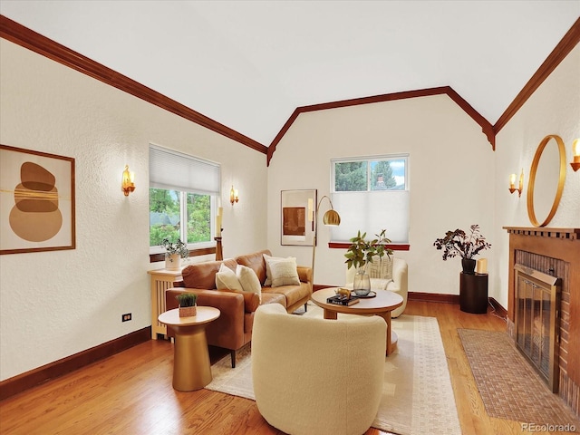 1247 Dexter St, Denver, CO 80220 - living area with vaulted ceiling, a brick fireplace, wood finished floors, crown molding, and a textured wall