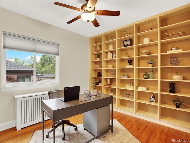 1247 Dexter St, Denver, CO 80220 - office featuring radiator, a ceiling fan, light wood-style flooring, and baseboards