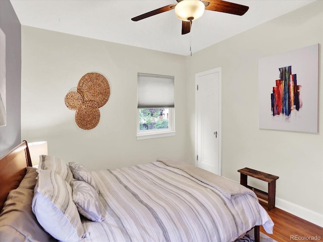 1247 Dexter St, Denver, CO 80220 - bedroom with wood finished floors, baseboards, and a ceiling fan