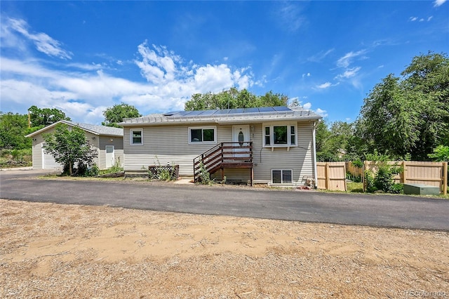 3145 S Bryant St, Sheridan, CO 80110 - view of front of home featuring roof mounted solar panels