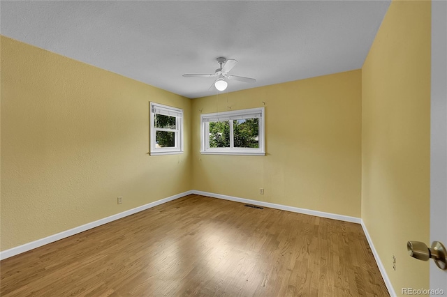 3145 S Bryant St, Sheridan, CO 80110 - spare room featuring a ceiling fan and wood finished floors