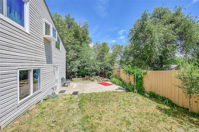 3145 S Bryant St, Sheridan, CO 80110 - fenced backyard featuring a patio