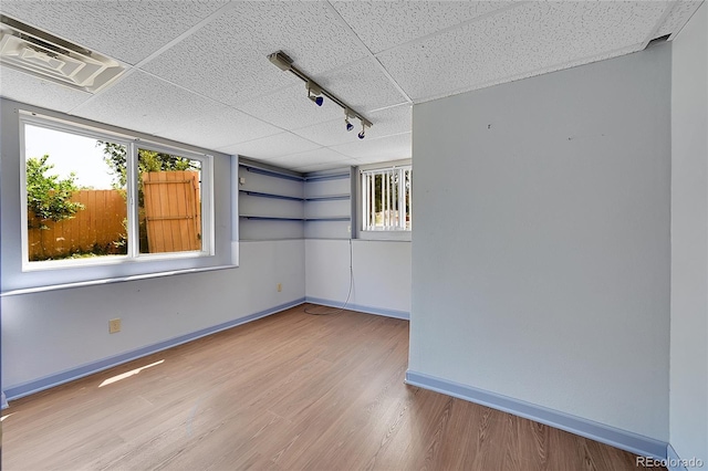 3145 S Bryant St, Sheridan, CO 80110 - unfurnished room featuring track lighting and wood finished floors
