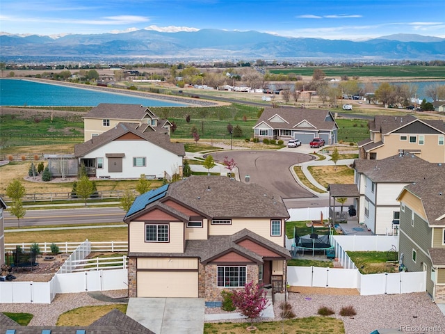 birds eye view of property with a mountain view