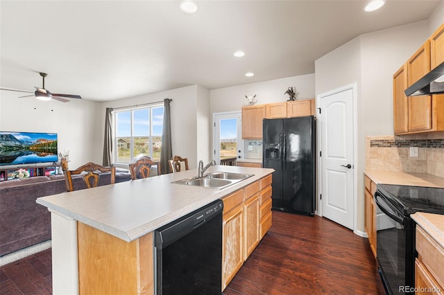 kitchen with dark wood-style flooring, light brown cabinetry, a sink, black appliances, and open floor plan