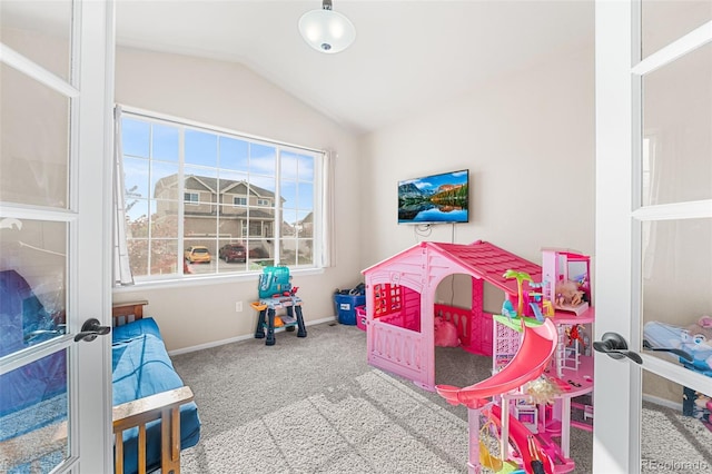 bedroom featuring baseboards, carpet, and lofted ceiling