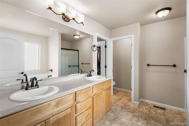 full bathroom featuring a sink, toilet, double vanity, and visible vents