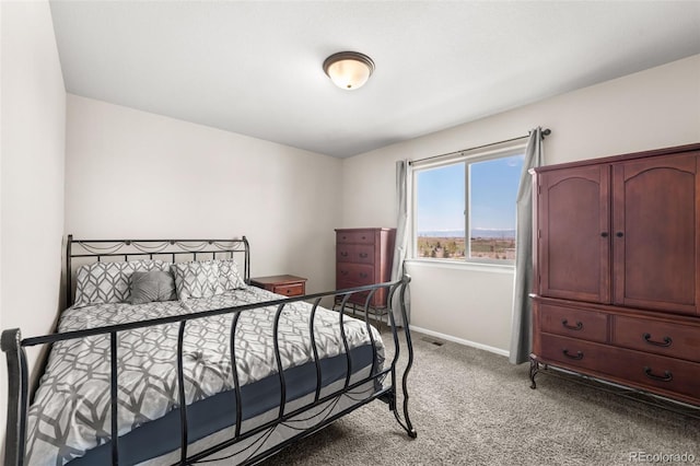 bedroom featuring baseboards, light carpet, and visible vents