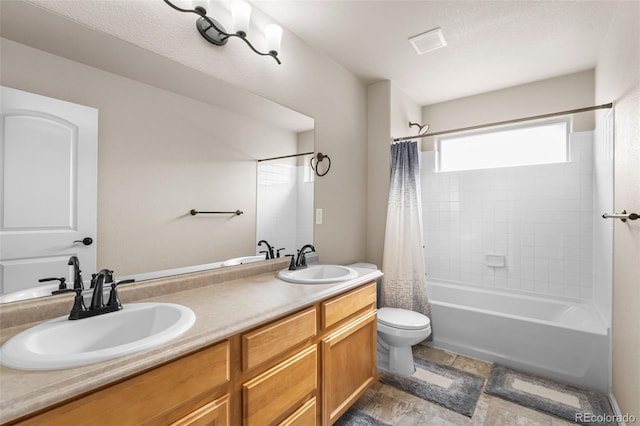 full bath featuring a sink, toilet, double vanity, and shower / tub combo