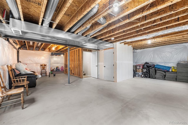 unfinished basement featuring visible vents