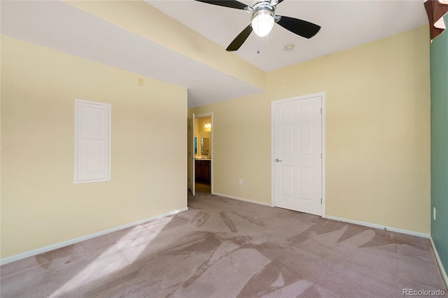 unfurnished room featuring light colored carpet and ceiling fan