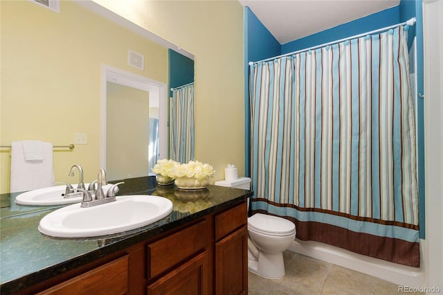 bathroom with tile patterned flooring, vanity, a shower with curtain, and toilet