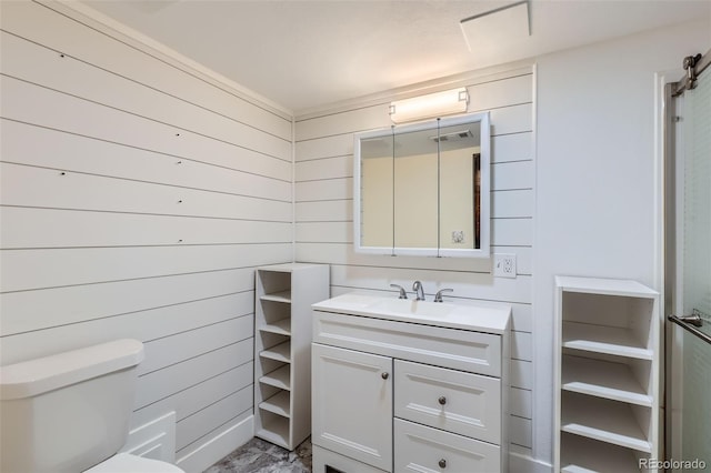 bathroom featuring vanity, toilet, and marble finish floor