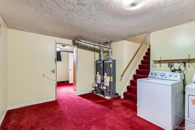 finished basement featuring gas water heater, a textured ceiling, stairs, and washing machine and clothes dryer