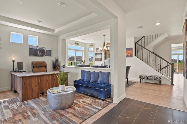16002 E 111th Cir, Commerce City, CO 80022 - living area featuring plenty of natural light, a chandelier, stairway, baseboards, and recessed lighting