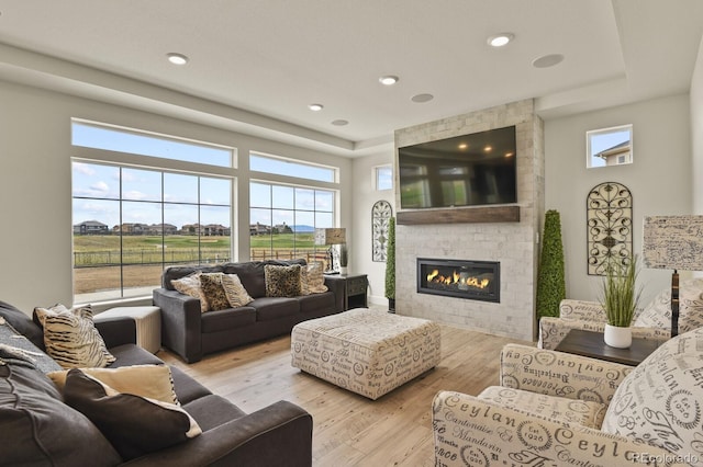 16002 E 111th Cir, Commerce City, CO 80022 - living room featuring a large fireplace and hardwood / wood-style floors