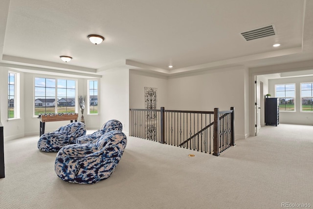 16002 E 111th Cir, Commerce City, CO 80022 - sitting room featuring a tray ceiling, carpet, an upstairs landing, baseboards, and recessed lighting