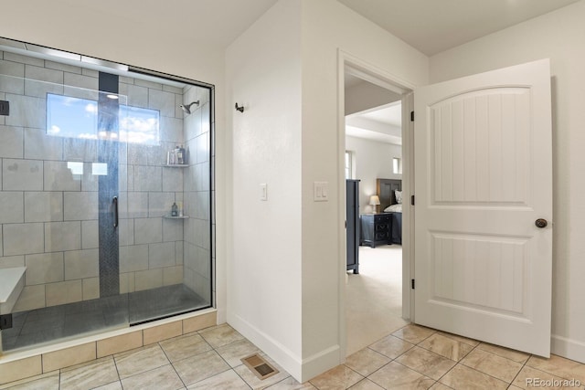 16002 E 111th Cir, Commerce City, CO 80022 - bathroom with tile patterned floors, a shower stall, and baseboards