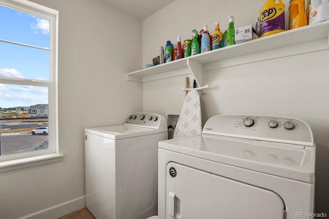 16002 E 111th Cir, Commerce City, CO 80022 - laundry room featuring washing machine and dryer and baseboards