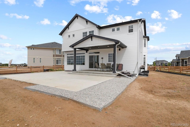 16002 E 111th Cir, Commerce City, CO 80022 - back of property featuring a patio and board and batten siding