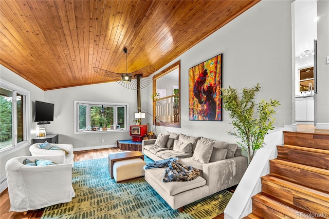 6549 Modoc Ln, Evergreen, CO 80439 - living area featuring wood ceiling, stairway, plenty of natural light, vaulted ceiling, and wood finished floors