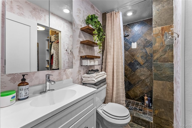 6549 Modoc Ln, Evergreen, CO 80439 - full bath with tiled shower, vanity, and recessed lighting