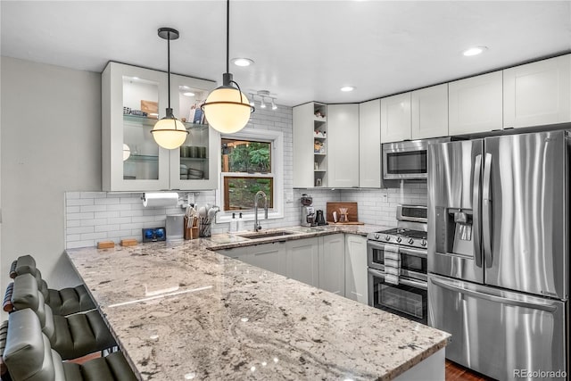 6549 Modoc Ln, Evergreen, CO 80439 - kitchen with appliances with stainless steel finishes, a peninsula, open shelves, light stone countertops, and recessed lighting