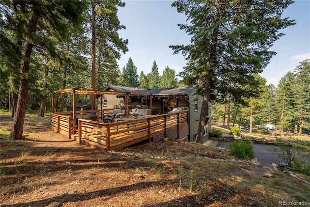 6549 Modoc Ln, Evergreen, CO 80439 - rear view of property featuring a deck and a wooded view