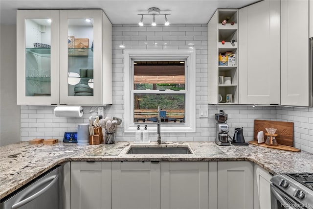 6549 Modoc Ln, Evergreen, CO 80439 - kitchen featuring white cabinetry, backsplash, appliances with stainless steel finishes, and light stone counters