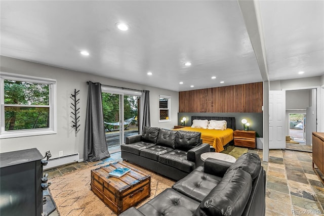6549 Modoc Ln, Evergreen, CO 80439 - living area with a baseboard heating unit, stone tile flooring, and recessed lighting