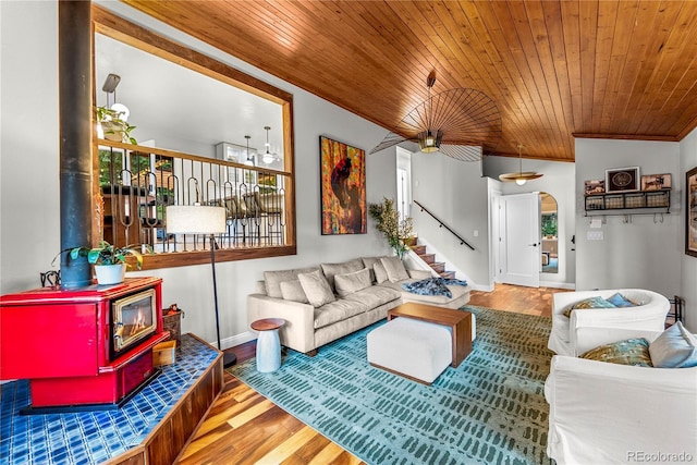 6549 Modoc Ln, Evergreen, CO 80439 - living room with a wood stove, wood ceiling, stairway, and wood finished floors