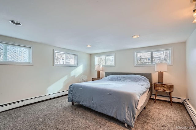 bedroom with carpet flooring, recessed lighting, and a baseboard radiator