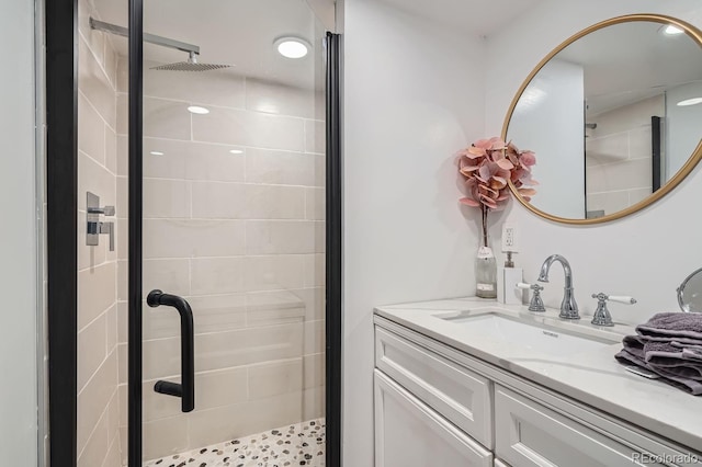 bathroom with vanity and a shower stall