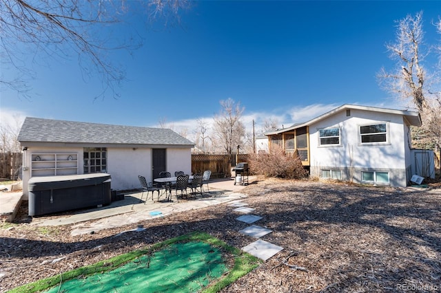 view of yard featuring a patio area, a hot tub, and fence