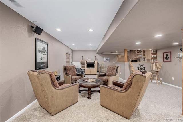 living room featuring carpet flooring, baseboards, and recessed lighting