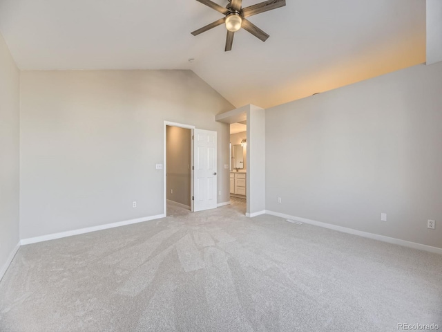 unfurnished bedroom featuring ceiling fan, light colored carpet, and lofted ceiling