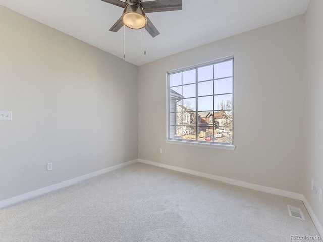 carpeted empty room with ceiling fan