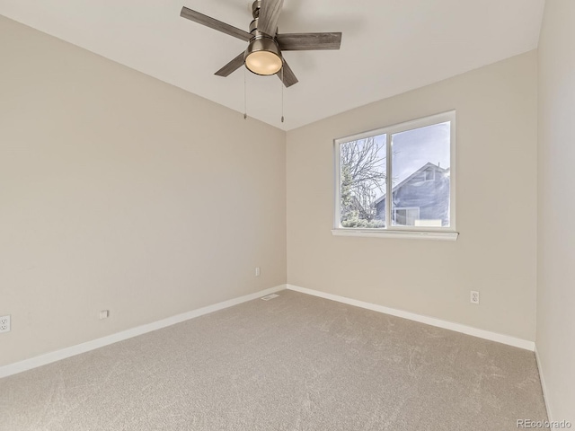 carpeted empty room with ceiling fan