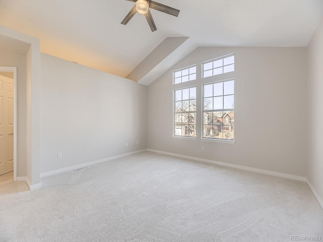 additional living space featuring light colored carpet, ceiling fan, and lofted ceiling