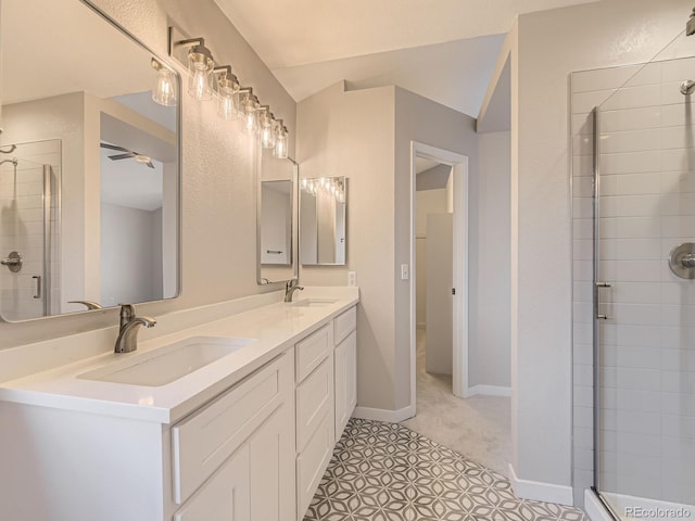 bathroom with vanity, tile patterned floors, ceiling fan, and a shower with shower door