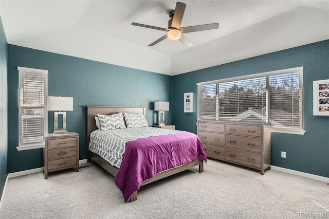 bedroom featuring lofted ceiling, carpet, a ceiling fan, and baseboards