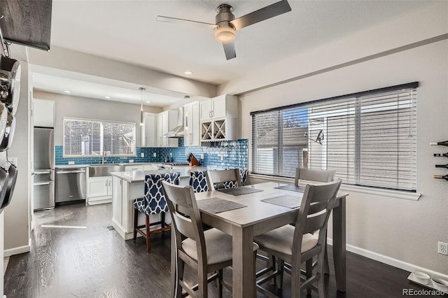 dining space featuring ceiling fan, baseboards, dark wood finished floors, and recessed lighting