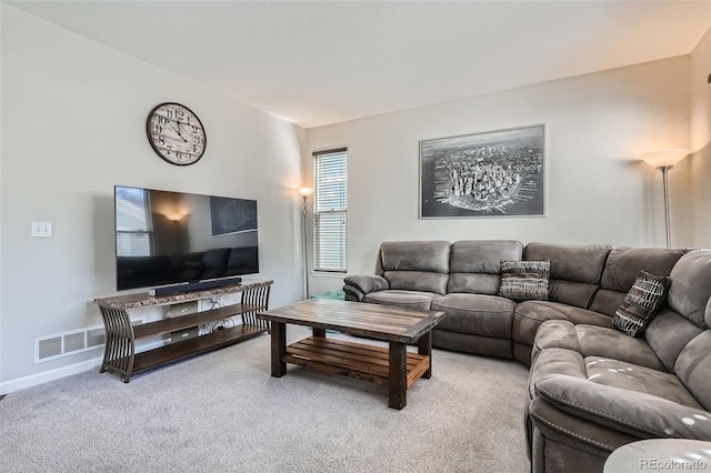 living area with light carpet and baseboards